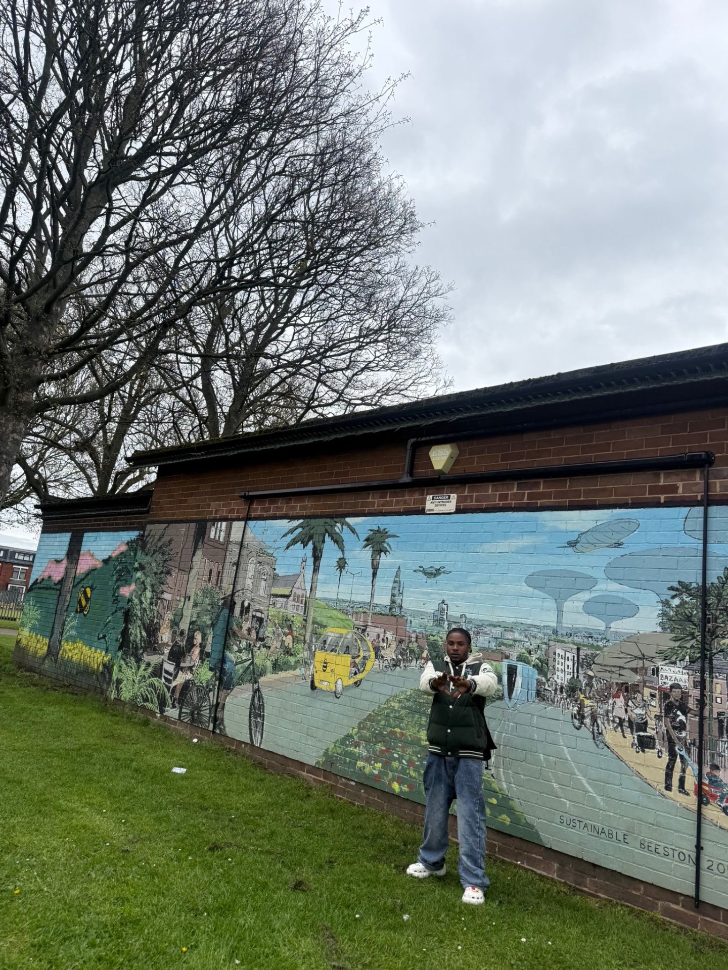 Mural pose, varsity jacket